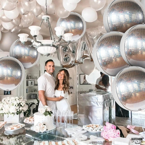 Party scene with 22 Inch Large Silver Disco Ball Foil Balloons Pack Of 6, Metallic Mylar Round Mirrors for event backdrop.