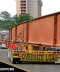 Tough As Nails Lever Load Binder For Half Inch Grade 70 Chain With 13000 Pound Working Load Limit And 52000 Break Strength Rock Solid Forged Steel Hauling Clamps Two Pack Heavy Duty Rigging Gear securing oversized load in transit on flatbed trailer.