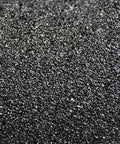Close-up of Kickass Anti Skid Safety Tape For Outdoor And Indoor Floors black grip surface with aluminum oxide texture.