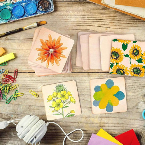 Six Shapes 1 Inch Paper Punches for crafting scrapbooking and card making on wooden table with colorful craft supplies