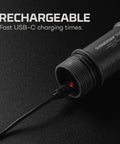 Submerser 500 Underwater Fishing Light with USB-C charging cable connected, showcasing rechargeable feature on black background.
