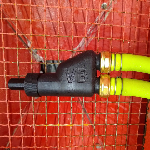 Wet Media Blast Gun Kit V3 Pro 3D Printed PETG Lightweight Tool with adjustable hoses against orange wire mesh background.