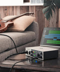 Volt 2 USB Audio Interface With Vintage Preamp Mode And 24-Bit 192 KHz Conversion in a home studio setup with guitar and tablet