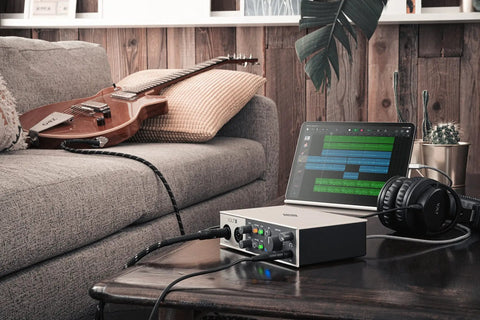 Volt 2 USB Audio Interface With Vintage Preamp Mode And 24-Bit 192 KHz Conversion in a home studio setup with guitar and tablet