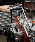 Mechanic using 53 Piece Mechanic Tool Set With Quarter And Eighths Inch Drives on engine with bright chrome finish
