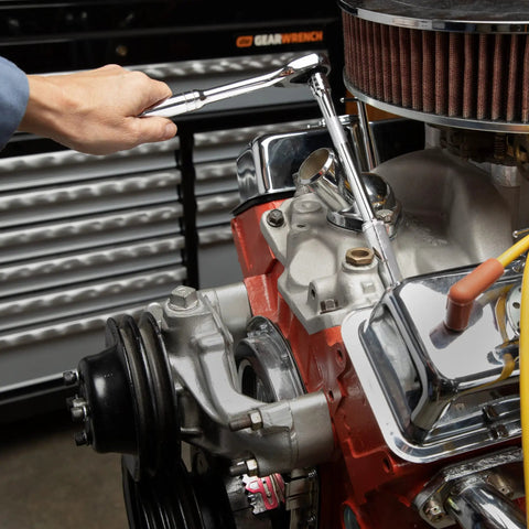 Mechanic using 53 Piece Mechanic Tool Set With Quarter And Eighths Inch Drives on engine with bright chrome finish