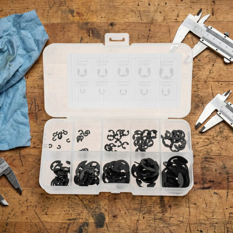 E Clip Assortment Kit 120 Pieces in 10 Sizes 1.5mm to 10mm External Retaining Rings in open box on wooden table