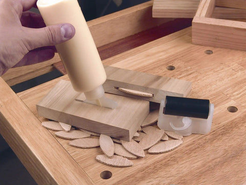Hefty No 10 Compression Beech Joiner Biscuits, 75 pieces, being glued into wooden panels for cabinet builds and furniture restorations.