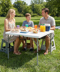 Family enjoying a picnic using a 34 Inch Folding Square Card Table Portable Heavy Duty HDPE Fold In Half With Carrying Handle