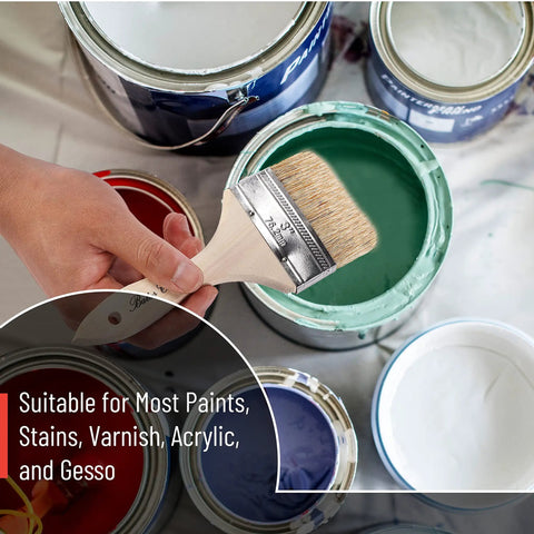 Hand holding a chip brush over green paint can with paint cans around. Six Pack Three Inch Chip Paint Brushes With Thick Natural Bristle