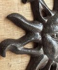 Close-up of Heavy Duty Cast Iron Coat Hooks Set Of Two Vintage Sunburst Wall Mounts With Installation Screws antique dark brown finish.