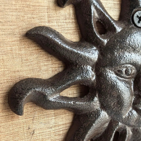 Close-up of Heavy Duty Cast Iron Coat Hooks Set Of Two Vintage Sunburst Wall Mounts With Installation Screws antique dark brown finish.