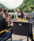 Group enjoying an outdoor evening around 45 Inch Propane Fire Table With 50000 BTU Fire Pit, Glass Wind Guard And Rain Cover