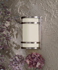 Bay View 1 Light Pocket Lantern Outdoor Light in Brushed Stainless Steel Finish mounted on wall with hydrangeas