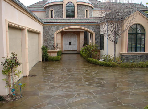 Turbo Wet Look Concrete Sealer Spray Delivers Beefed Up High Gloss Finish For Exterior Masonry And Pavers on a driveway.