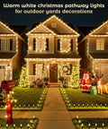 Outdoor Christmas Pathway Lights 2 Pack, 51.4 Ft Total, 40 Bulbs, illuminating a decorated yard and pathway at night.