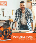 Man in workshop with Heavy Duty 50 Ft Retractable Extension Cord Reel With 4 Outlets, Easy Rewind Handle, ideal for DIY projects