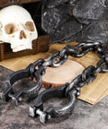 Halloween Plastic Wrist Shackles Handcuffs With Chain Links For Cosplay And Party Decor on stone surface with skull prop