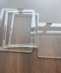 Clear plexiglass router table insert plates arranged on a wooden surface, part of Shop Grade Router Table Insert Plate With Rabbet Cutout Template Kit Designed To Nail Your 11.75 By 9.25 Inch Workbench Mount For Sweet Sharp Daily Cuts.