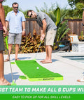 Group playing on BattlePutt 11 Ft Backyard Putting Green Pong Style Golf Mat With Two Putters Two Balls Twelve Hole Covers