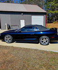 Top Shelf Tinted Blue Paint Basecoat Gallon Ready To Spray With Slow Reducer Blend For Ultra Smooth Automotive Finish That Hits Perfect And Looks Totally Fresh On Any Ride on a black convertible car.