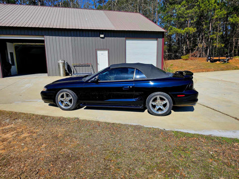 Top Shelf Tinted Blue Paint Basecoat Gallon Ready To Spray With Slow Reducer Blend For Ultra Smooth Automotive Finish That Hits Perfect And Looks Totally Fresh On Any Ride on a black convertible car.