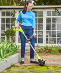 Premium Heavy Duty 18V Cordless Battery Powered Floor Pressure Washer For Concrete Patios Deck And Stone Pathway That Kicks Ass At Removing Mold And Tough Yard Grime in use on patio