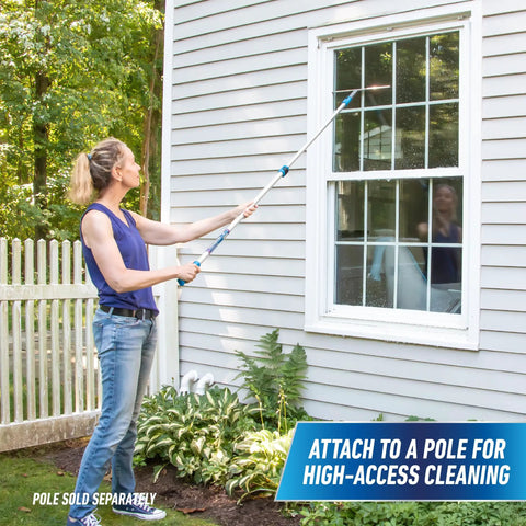 Person cleaning window with Pro Grade Stainless Steel 12 Inch Heavy Duty Window Squeegee For Streak Free Glass Cleaning Tough Handle With Ergonomic Grip Industrial Window Tool Built For Home Office And Janitorial Use using pole attachment.