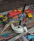 Get This Awesome 2 in 1 Dual Shoe Conduit Bender For Quick EMT And Rigid Pipes on a tool table with various tools.