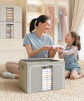 A mother and daughter with Foldable Metal Frame Storage Bins Set For Clothes And No Fuss Organization, 100L Each, 3 Pack displayed.
