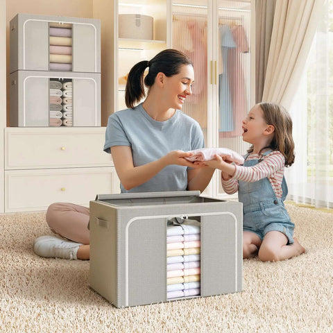 A mother and daughter with Foldable Metal Frame Storage Bins Set For Clothes And No Fuss Organization, 100L Each, 3 Pack displayed.