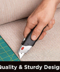 Internet's Best retractable utility knife with rubber handle; hand-held close-up showing the blade.