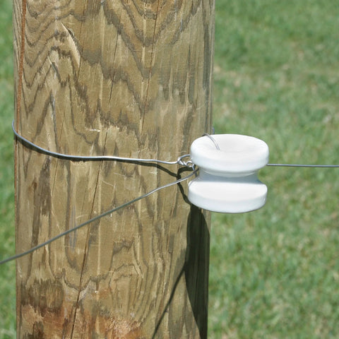 Zareba large white ceramic corner post insulator on wood post for electric fencing