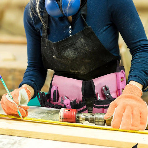 Person using tools with adjustable tool belt with 2 large pouches, 10 small pockets and hammer loop, waist strap fits 22 to 44 inches
