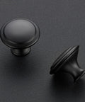 Matte Black Kitchen Cabinet Knobs And Pulls 1 1/4 Inch 40 Pack Easy Install Durable Metal Hardware Upgrade For Cabinets Modern Farmhouse Look To Spruce Up Your Space. Matte black round cabinet knobs in close-up