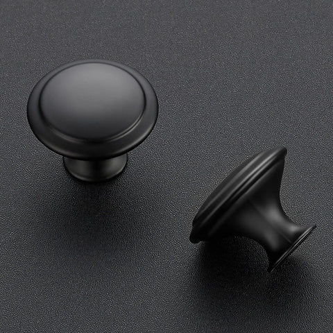 Matte Black Kitchen Cabinet Knobs And Pulls 1 1/4 Inch 40 Pack Easy Install Durable Metal Hardware Upgrade For Cabinets Modern Farmhouse Look To Spruce Up Your Space. Matte black round cabinet knobs in close-up