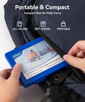 Person placing Travel Ready All In One Magnetic Eyeglasses Repair Kit into backpack, showcasing portable case for quick fixes on the go.