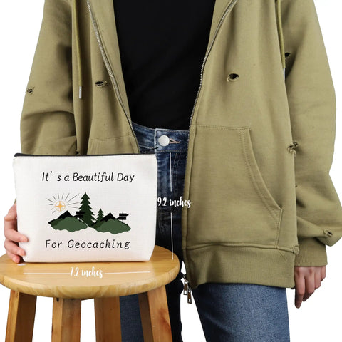 Person holding Geocaching Makeup Bag For Outdoor Lovers It Is A Beautiful Day For Geocaching Gift Beige Durable Canvas Zip Bag