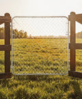 Adjustable Gate Kit For Chain Link Fence With Round Frame That Fits 24-72 Inch Openings And Up To 12 Feet in a field view