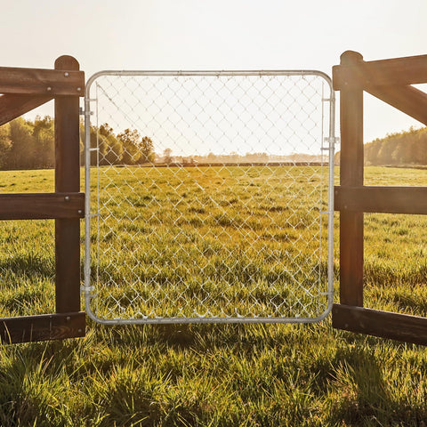 Adjustable Gate Kit For Chain Link Fence With Round Frame That Fits 24-72 Inch Openings And Up To 12 Feet in a field view