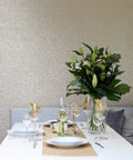 Gold Sequin Wallpaper Roll With Sparkle Finish For Living Rooms And Feature Walls Metallic Texture 20.5 Inches By 19.5 Feet Full Roll Glam Wall Decor That Turns Heads behind a dining table with flowers