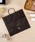 100 Pack Stand Open Paper Shopping Bags With Handles For Grab And Go Takeout And Retail Durable Kraft Paper Carrier Bags 14.17 X 8.26 X 13.19 Inches Easy Carry Totes shown on table with food items nearby