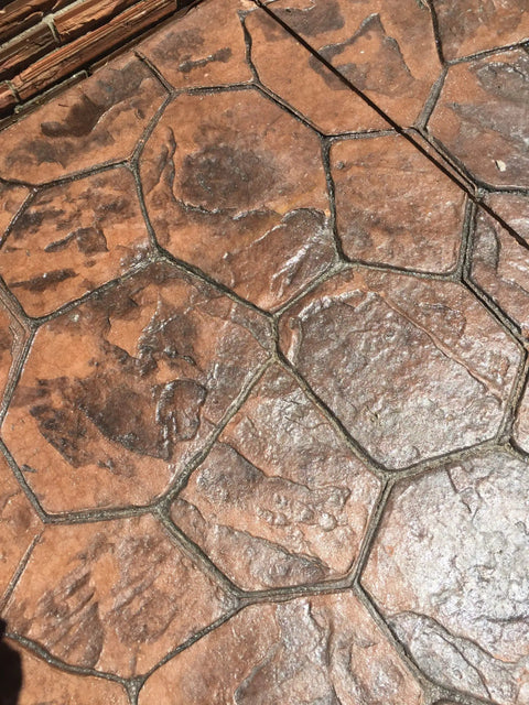 Heavy Duty 25 Percent High Solids Styrene Acrylic Concrete Sealer Brings Out Natural Color And Kills Whitening On Brick And Paved Slabs Real Deal 5 Gallon Can Protection applied on textured brown stamped concrete patio surface.
