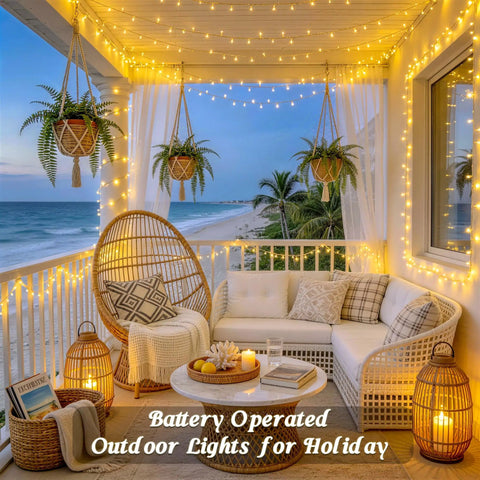 Two Pack Outdoor String Lights Battery Operated, 66 Ft Total, 200 LED Fairy Lights adorn a cozy beachside porch setting