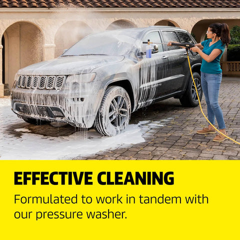 Person uses All In One Vehicle Wash And Wax Soap For Pressure Washers Heavy Duty Clean And Shine on SUV with foam coverage