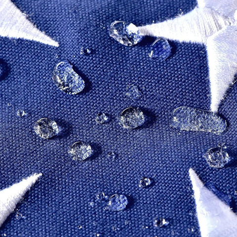 Close-up of water droplets on Outdoor 3x5 Foot American Flag Built Tough Deluxe Heavy Duty Spun Polyester Tear Resistant Waterproof All Weather High Wind USA Flag With Embroidered Stars Sewn Stripes Brass Grommets