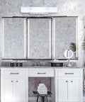 Four Light Interior Wall Fixture With Ground Convenience Outlet, White Ceramic Glass, above a bathroom mirror setup