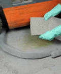 Heavy Duty Polypropylene Absorbent Socks For Flood Fighting Zero Sweat With Leaks Straight Up Industrial Grade Drain Guards in use near forklift.