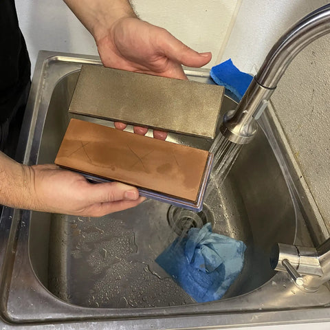 Hands using Diamond Lapping Plate 220 Grit for Flattening Waterstones and Sharpening Blades Ultra Flat to Under 0.0005 Inches Made in USA