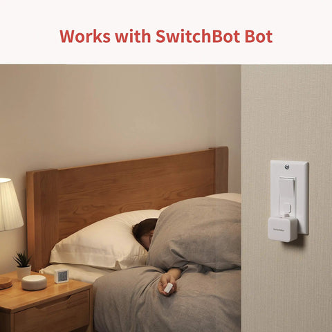 Sleeping person using One Tap Smart Remote For Your Home Automation Needs Works With Curtain Bot Color Bulb LED Strip Blind Tilt And Plug Mini Bluetooth Five Point Zero Long Range Easy Control No Phone Required by bed.